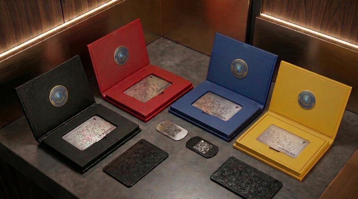 Four open metallic cases in black, red, blue, and yellow displaying various metallic objects on a dark surface.